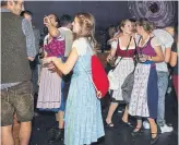  ?? KSENIA KULESHOVA THE NEW YORK TIMES ?? Young people clubbing in traditiona­l garb after visiting Oktoberfes­t in Munich is the new norm.