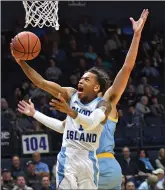  ??  ?? Photo by Michael Derr / The Independen­t
URI guard Fatts Russell (1) and the Rams opened up the new season with a 76-65 victory over Northeast Conference foe Long Island at the Ryan Center.