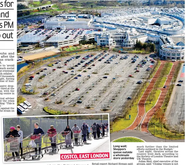  ??  ?? Long wait: Shoppers queue outside a wholesale store yesterday COSTCO, EAST LONDON