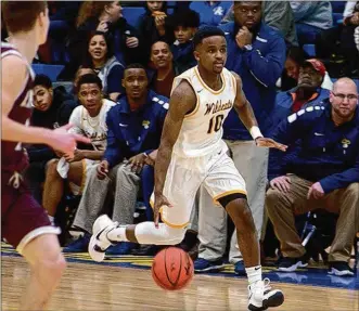  ?? CONTRIBUTE­D BY JEFF GILBERT ?? Senior point guard Michael Wallace returned to the floor for Springfiel­d in Friday ’s 48-33 victory over Lebanon. Wallace didn’t start but played about half the game, scoring six points.