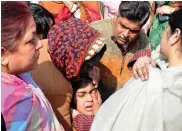  ?? — ASIAN AGE ?? Relatives mourn after four members of a family died in a fire at Dilshad Garden on Tuesday.
