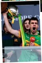  ?? ?? Offaly pleased: Rhode’s players celebrate and (inset) captain Niall McNamee lifts the trophy
