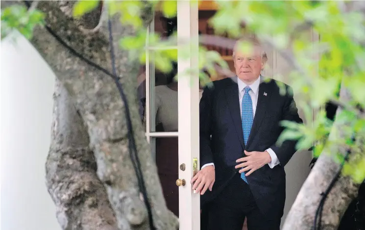  ?? JIM WATSON / AFP / GETTY IMAGES ?? U. S. President Donald Trump leaves the White House on Friday. He will overcome his critics and will change America, Conrad Black writes.