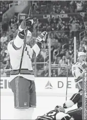  ?? Gus Ruelas Associated Press ?? NEW YORK’S Rick Nash celebrates after his shot was knocked in by center Brad Richards for a goal in the first period. Richards scored again in the second.