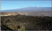  ?? CALEB JONES — THE ASSOCIATED PRESS FILE ?? Hawaii's Mauna Loa volcano, background, towers over the summit crater of Kilauea volcano in Hawaii Volcanoes National Park on the Big Island on April 25, 2019.