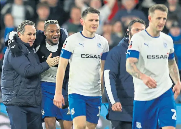  ??  ?? CUP JOY: Micky Mellon celebrates with his Tranmere Rovers players after knocking Watford out of the FA Cup in January 2020.