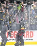  ??  ?? Robin Lehner gives a stick to a fan.