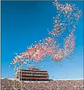  ?? AJ MAST/AP 2017 ?? Some colleges are ending the tradition of releasing balloons into the air before football games.