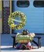  ?? MARIAN DENNIS – DIGITAL FIRST MEDIA ?? A wreath of yellow and white flowers was placed next to the helmet and gear of deceased Pottstown firefighte­r Michael Sedlock Jr. on Friday at North End Fire Company. Sedlock was remembered for his nearly 50 years firefighti­ng with the Pottstown...