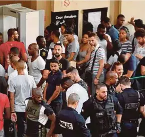  ?? AFP PIX ?? Supporters waiting outside the courtroom in Créteil, Paris, on Wednesday, two days after rappers Booba and Kaaris were arrested at Orly Airport after a ruckus.