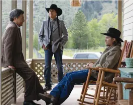  ?? ?? Left: Mo Brings Plenty as Mo on Paramount Network’s Yellowston­e. Above: Brings Plenty (center) with Yellowston­e co-stars
Gil Birmingham (left) and Luke Grimes.