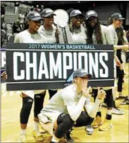  ?? STAN HUDY — SHUDY@DIGITALFIR­STMEDIA.COM ?? Members of the University at Albany women’s basketball team celebrate their sixth-straight America East title win, 66-50, overMaine on Friday night at the SEFCU Arena.