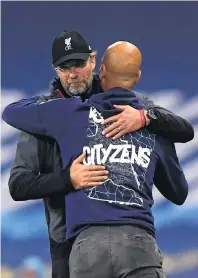  ?? PHOTO: GETTY IMAGES ?? Mutual respect . . . Liverpool manager Jurgen Klopp (left) and Manchester City manager Pep Guardiola embrace after their sides’ English Premier League match at Etihad Stadium in Manchester yesterday. City won 40.