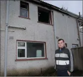  ??  ?? Anthony Kiely at the rear of the burnt out house in Moyvane that is still open to the elements.