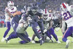  ?? AFP ?? The Titans’ Derrick Henry, No.22, scores a touchdown against the Bills in Nashville.