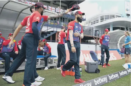 ?? ?? England’s Moeen Ali leads his team out ahead of the fifth T20 Internatio­nal match between West Indies and England at Kensington Oval.