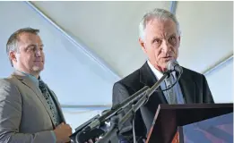  ?? CLYDE MUELLER/THE NEW MEXICAN ?? Head of School Terry Passalacqu­a, right, speaks Wednesday during the Desert Academy graduation ceremony at the school’s campus. He is stepping down after 21 years with the school and Assistant Head of Schools Yann Lussiez, rear, will replace him.