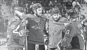  ?? PABLO MARTINEZ MONSIVAIS THE ASSOCIATED PRESS ?? Washington Capitals right wing Tom Wilson, second from left, celebrates his goal against the Ottawa Senators with teammates Nicklas Backstrom (19), Michal Kempny and Jakub Vrana (13). Although younger than his fellow Czech teammates, Vrana has taken...