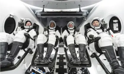  ??  ?? Nasa astronauts Shannon Walker, Victor Glover, commander Mike Hopkins and Japan Aerospace Exploratio­n Agency astronaut Soichi Noguchi inside SpaceX’s Crew Dragon spacecraft. Photograph: AP