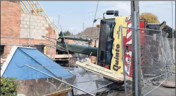  ??  ?? A crane toppled over on St George’s Avenue in Hinckley on October 14