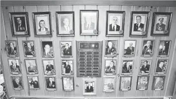  ??  ?? The members of the year wall. Poppies mark those now deceased.