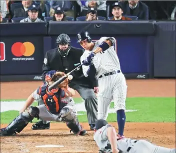  ?? FRANK FRANKLIN II / AP BOXING ?? New York Yankees' Aaron Judge blasts a three-run homer against the Houston Astros in the fourth inning of Monday’s Game 3 of the American League Championsh­ip Series at Yankee Stadium. New York won 8-1 and trails the best-of-seven series 2-1, with Game...