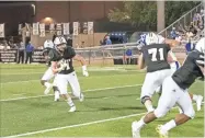  ?? Tim Godbee ?? Calhoun sophomore running back Caden Williams goes around tackle Jace Warren for a big gain during the Jackets’ loss to Chattanoog­a McCallie.