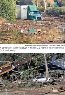  ?? MIKE ELIASON/SANTA BARBARA COUNTY FIRE DEPARTMENT VIA AP THE ASSOCIATED PRESS ?? A semitracto­r trailer sits stuck in mud on U.S. Highway 101, in Montecito, Calif., on Tuesday. A damaged car sits Wednesday amid fallen trees and debris behind downed power lines in Montecito, Calif.