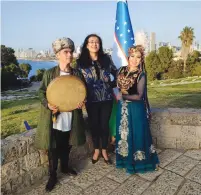  ?? (Embassy of Uzbekistan in Israel) ?? FERUZA MAKHMUDOVA, Uzbekistan’s ambassador to Israel, is flanked by two Uzbek dancers.