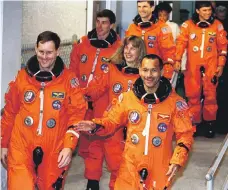  ?? AFP ?? Space shuttle Discovery commander Charles Bolden, front right, accompanie­d by Sergei Krikalev, the first Russian to share in a US space flight, at the launch pad in Florida in 1994