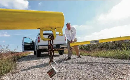  ?? Jon Shapley / Houston Chronicle ?? Richard Long of the Army Corps says Addicks Dam, built in the 1940s, withstood Hurricane Harvey with only “limited issues.”