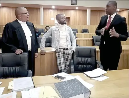  ?? (Pics: Kwanele Dlamini) ?? (L-R) Human Rights Lawyer Sibusiso Nhlabatsi, Founder of Eswatini Sexual and Gender Minorities Melusi Simelane and Registrar of Companies Msebe Malinga during a brief adjournmen­t yesterday.