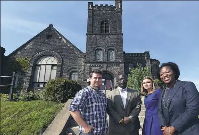  ?? Bob Donaldson/Post-Gazette ?? Standing outside the 110-year-old Albright Methodist Church in September are, from left, Ryan Morden, Abass B. Kamara, Lindsay Patross and Taafori Kamara. Mr. Morden and Ms. Patross are with Friends of Albright. The Kamaras are brother and sister and...