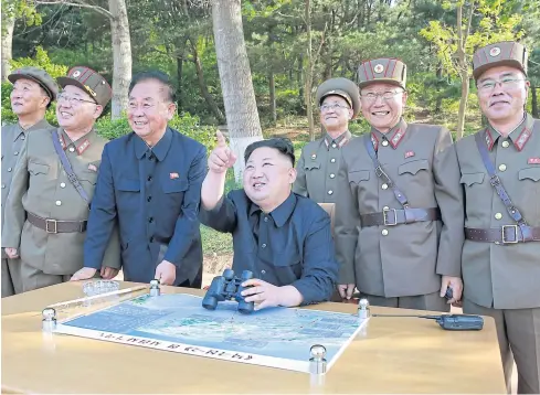  ?? REUTERS ?? This file photo released in 2017 shows North Korean leader Kim Jong-un inspecting an intermedia­te-range ballistic missile test with Kim Jong-sik, second left, Ri Pyongchol, third left, and Jang Chang-ha, right. It is reported that Gen Ri, an army top adviser, was demoted last week.