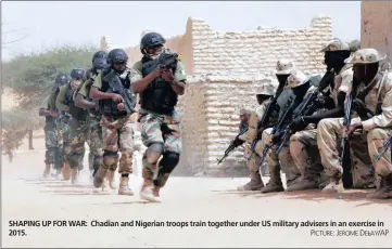  ??  ?? SHAPING UP FOR WAR: Chadian and Nigerian troops train together under US military advisers in an exercise in 2015.