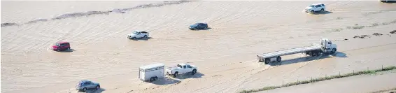  ??  ?? Floodwater on the Interstate 5 backed up weekend traffic for hours in Williams, California.