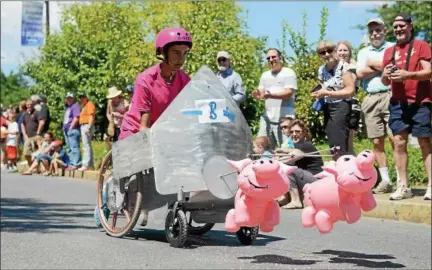  ?? TANIA BARRICKLO — DAILY FREEMAN FILE ?? Carson Parks, 16, son of Aimee and Mike Parks of Kingston, makes his way down Broadway during the 2014 Artist Soapbox Derby in Kingston, N.Y.