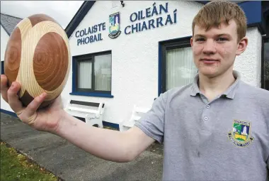  ?? Photo by John Reidy ?? The shape of things to come: Castleisla­nd student, Jordan Coffey who has been taking part in trials for the Munster Rugby U-16 Developmen­t Squad. Jordan is pictured with a product of the Castleisla­nd Community College woodwork room lathe.