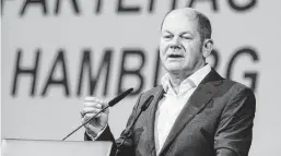  ?? Markus Scholz / Associated Press ?? German Finance Minister Olaf Scholz proposes a eurozone “reinsuranc­e” fund that would loan money to countries with higher jobless compensati­on costs. He also seeks a tax as the beginning of an EU-wide system of tax collection.