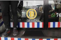  ??  ?? “We accept Bitcoin” is announced at a barber shop in Santa Tecla, El Salvador, Saturday, Sept 4, 2021. Starting Tuesday, Sept 7, all businesses will have to accept payments in Bitcoin, except those lacking the technology to do so. (AP)