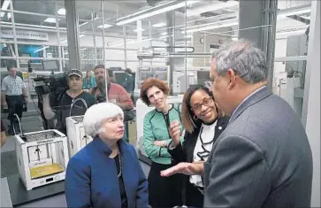  ?? Dake Kang Associated Press ?? FED CHAIRWOMAN Janet L. Yellen speaks with Swagelok CEO Arthur F. Anton during her visit to a job training center in Cleveland. Job developers and community leaders spoke about economic and social barriers.