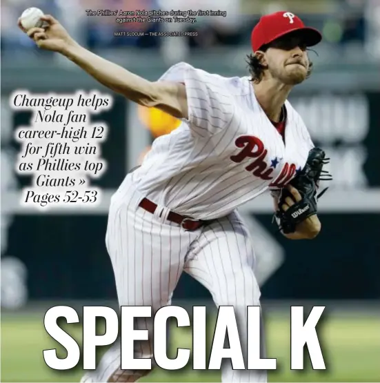  ?? MATT SLOCUM — THE ASSOCIATED PRESS ?? The Phillies’ Aaron Nola pitches during the first inning against the Giants on Tuesday.