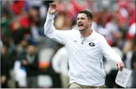  ?? JOSHUA L. JONES — ATHENS BANNER-HERALD VIA AP, FILE ?? Defensive coordinato­r Dan Lanning looks on during warmups before the 2019 Georgia spring game.