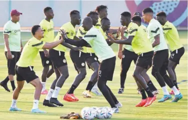  ?? Agence France-presse ?? Senegal’s players take part in a training session at the Duhail SC training facilities in Doha on Thursday, on the eve of their match against Qatar.