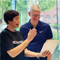  ??  ?? Vasey with Tim Cook during his first visit to Singapore in 2019 as Apple CEO. Opposite page: The Meshminds Foundation harnessed the storytelli­ng power of augmented reality for this public art walking trail last year. One of the works featured is Singaporea­n artist Robert Zhao Renhui’s The Time Tree