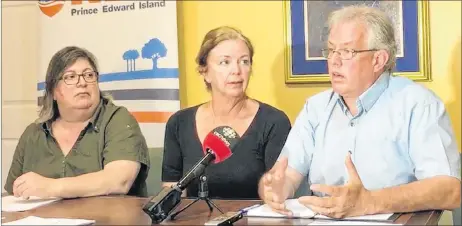  ?? STUART NEATBY/THE GUARDIAN ?? Margaret Andrade, left, who helped develop the NDP of P.E.I.’s sexual harassment policy, listens as party president Leah-Jane Hayward and leader Joe Byrne speak to the media.