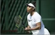  ?? JOHN WALTON — PA VIA AP ?? Serena Williams practices on the grass court at Wimbledon, ahead of the start of the 2018 Wimbledon Tennis Championsh­ips, in London Saturday. Williams is scheduled to play Dutch contender Arantxa Rus at Wimbledon on July 2.