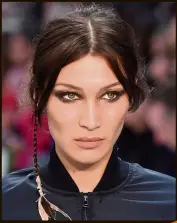  ??  ?? Max Mara showed slightly smudged smokey eyes that could add a punk rock touch to your look in the coming season.