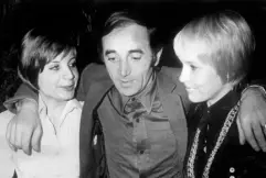  ??  ?? FAMILY MAN: Singer-songwriter Charles Aznavour is met by his daughter Patricia, left, and his wife Ulla upon his arrival at Stockholm, Sweden, in November 1968. Photo: AFP/Getty Images