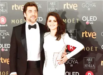  ?? — AFP photo ?? In this file photo taken on Feb 3, Spanish actors Javier Bardem (Left) and Penelope Cruz pose on the red carpet at the 32nd Goya awards ceremony in Madrid. The 71st Festival de Cannes will take place from May 8 to May 19.